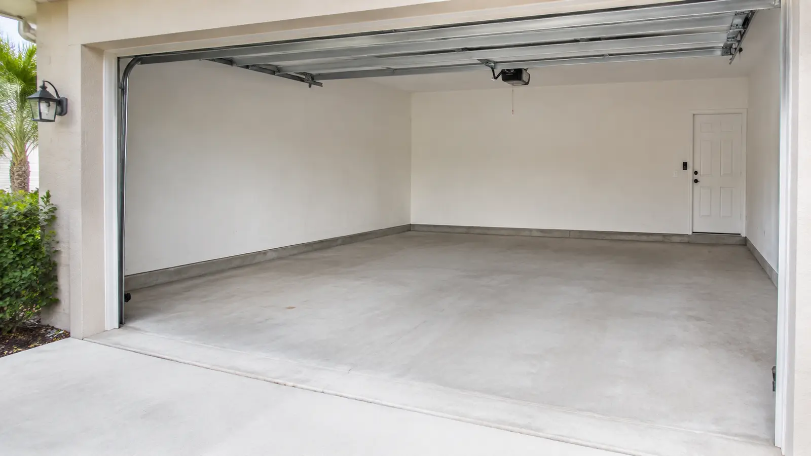 Representative example of a clean and empty two-car garage after junk removal