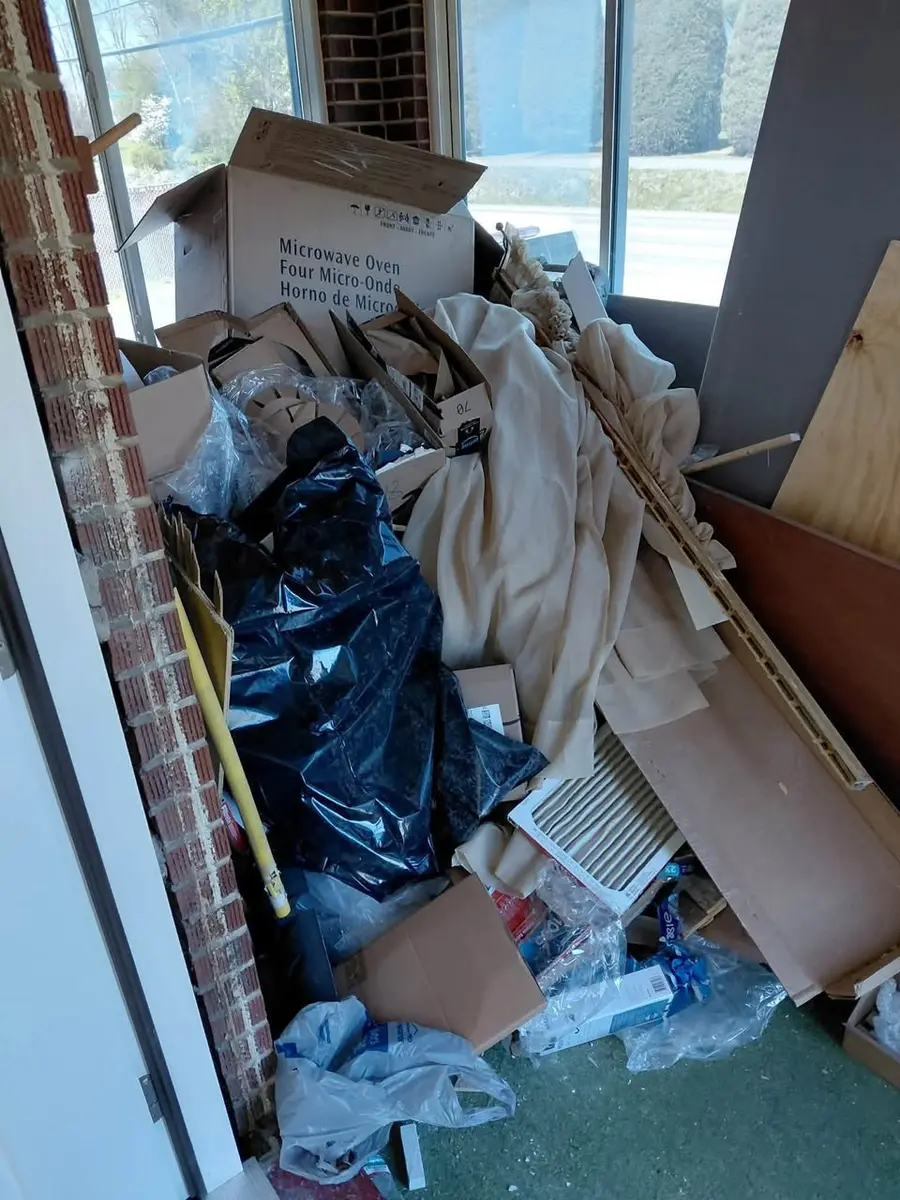Property debris prepared for removal by the junk hauling crew